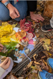 Students participating in land based learning outside in the fall